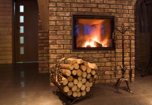 Fire wood against a fireplace